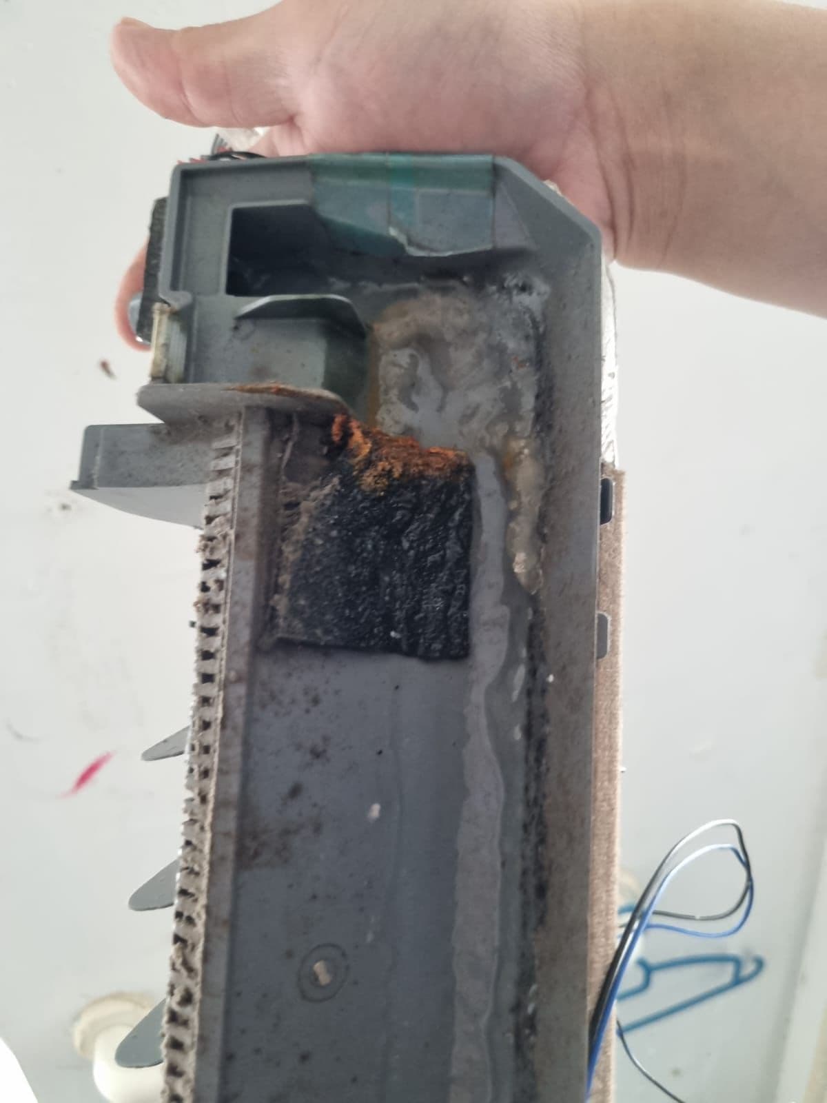 A cleaned aircon drainage tray after algae and debris removal